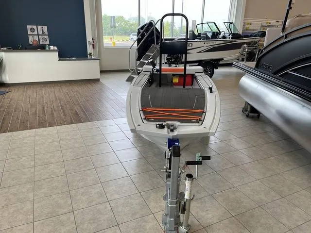 Slide: The Image of 2023 Veer V13 boat displayed in showroom with tiled floor and large windows. - 4