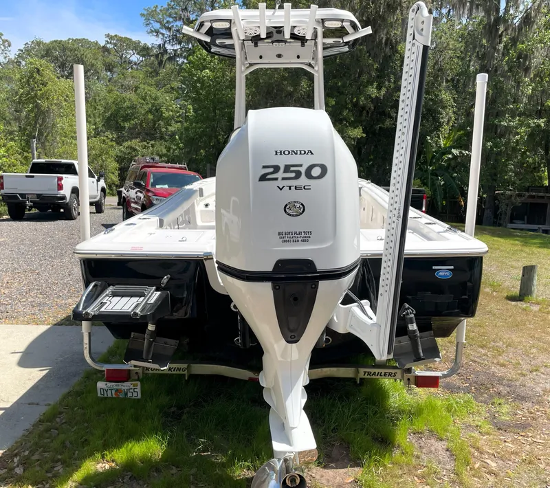 Slide: The Image of 2020 Tidewater 2300 Carolina Bay boat with Honda 250 VTEC engine, parked outdoors. - 11