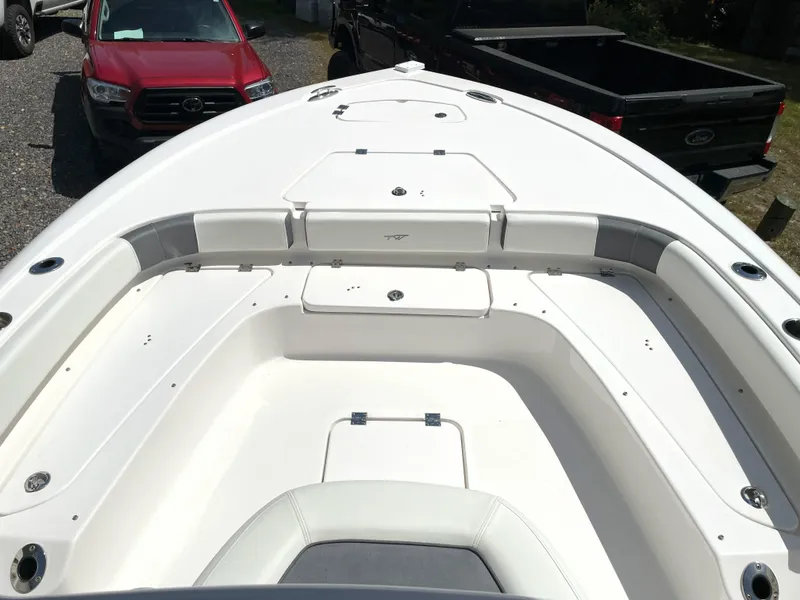 Slide: The Image of 2020 Tidewater 2300 Carolina Bay boat interior with spacious seating and storage compartments. - 25