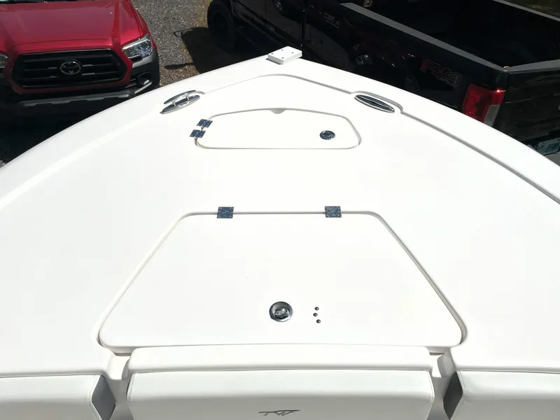 Slide: The Image of 2020 Tidewater 2300 Carolina Bay boat deck with storage compartments. - 26