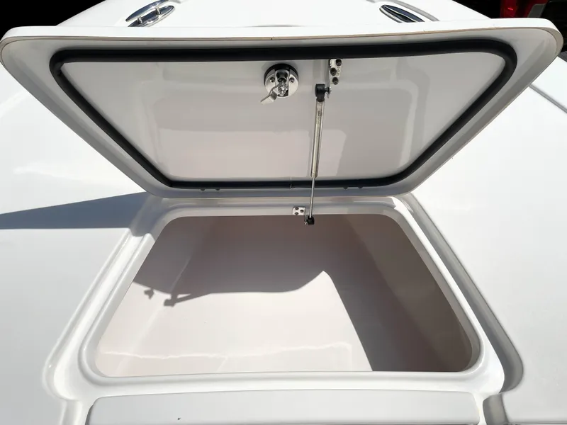 Slide: The Image of Open storage compartment on 2020 Tidewater 2300 Carolina Bay boat. - 28