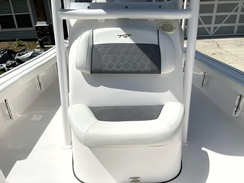 Slide: The Image of 2020 Tidewater 2300 Carolina Bay boat seat with white and gray upholstery. - 33