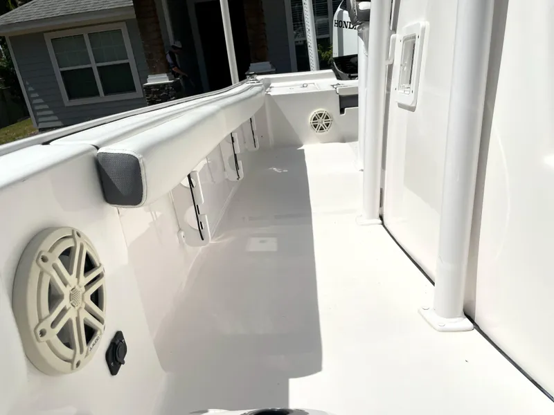 Slide: The Image of 2020 Tidewater 2300 Carolina Bay boat interior with speakers and storage compartments. - 35