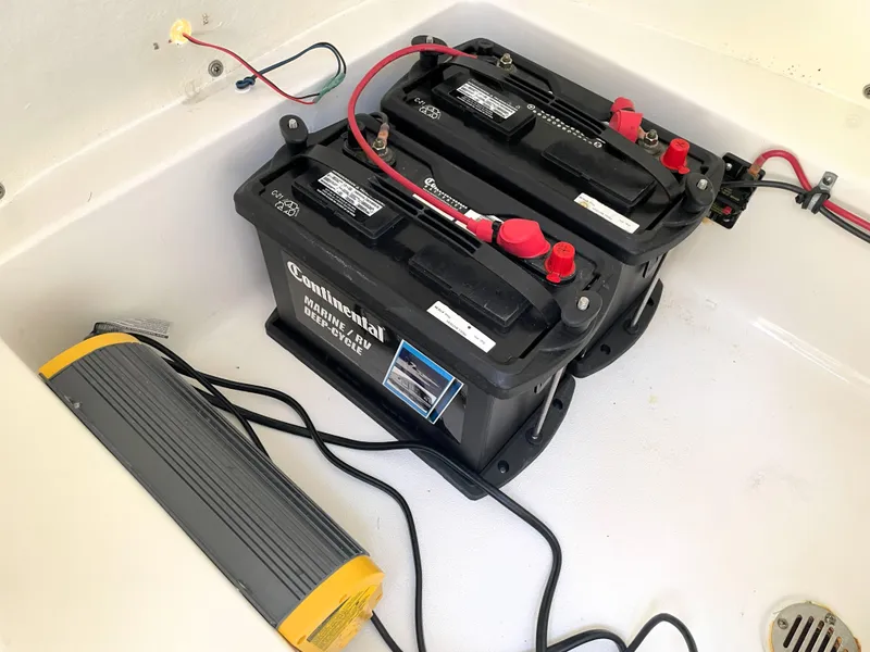 Slide: The Image of Batteries and charger in 2020 Tidewater 2300 Carolina Bay boat compartment. - 41