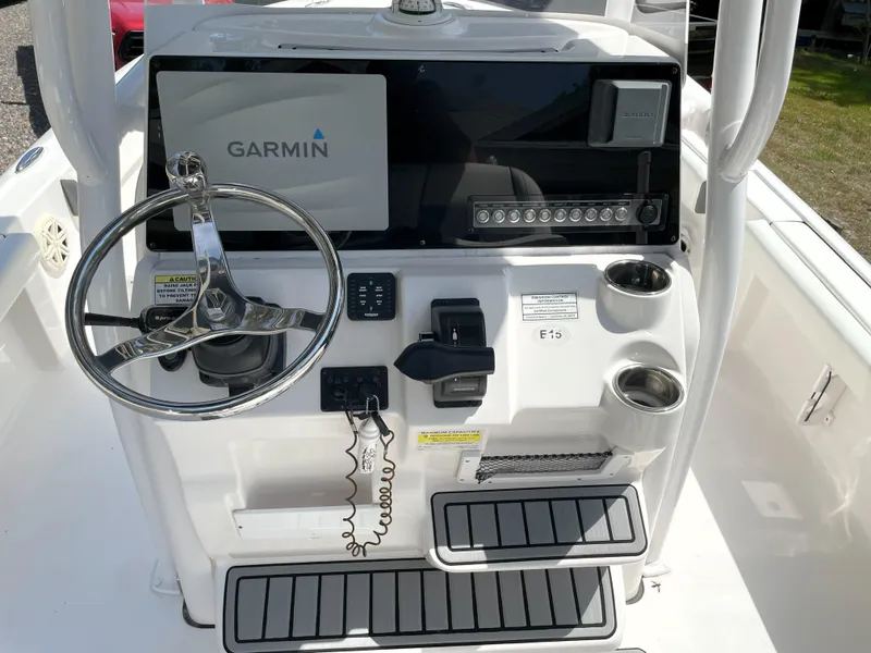 Slide: The Image of 2020 Tidewater 2300 Carolina Bay boat console with Garmin navigation system and steering wheel. - 46