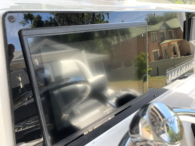 Slide: The Image of Dashboard of 2020 Tidewater 2300 Carolina Bay boat with Garmin display. - 47