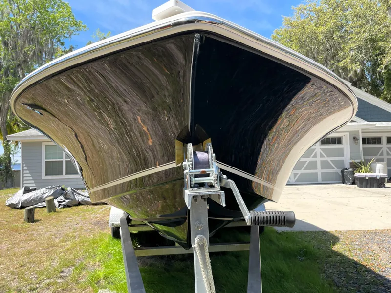 Slide: The Image of 2020 Tidewater 2300 Carolina Bay boat on trailer, parked in driveway. - 7