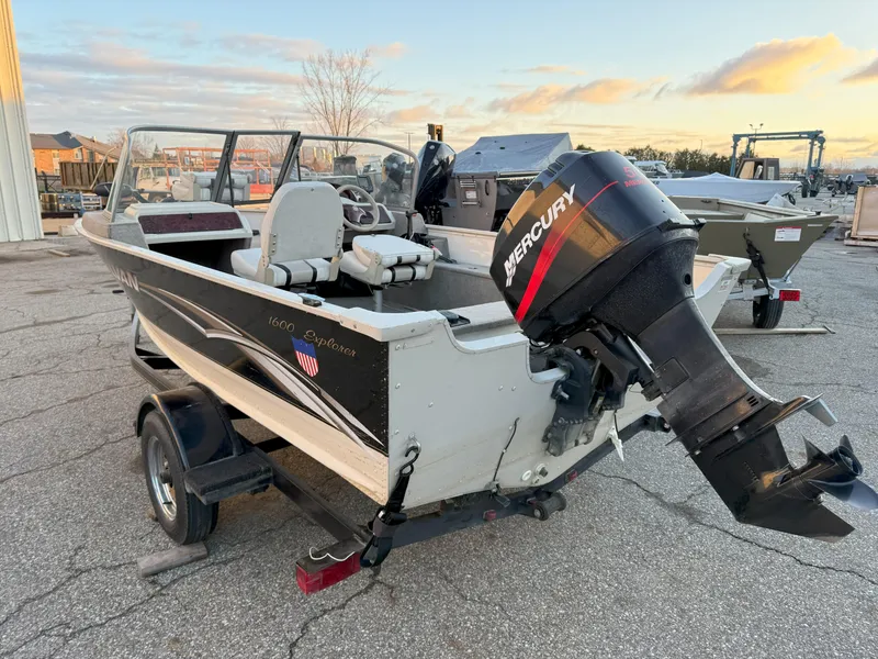 Slide: The Image of 2004 Sylvan 1600 Explorer DC boat with Mercury outboard motor on trailer. - 4