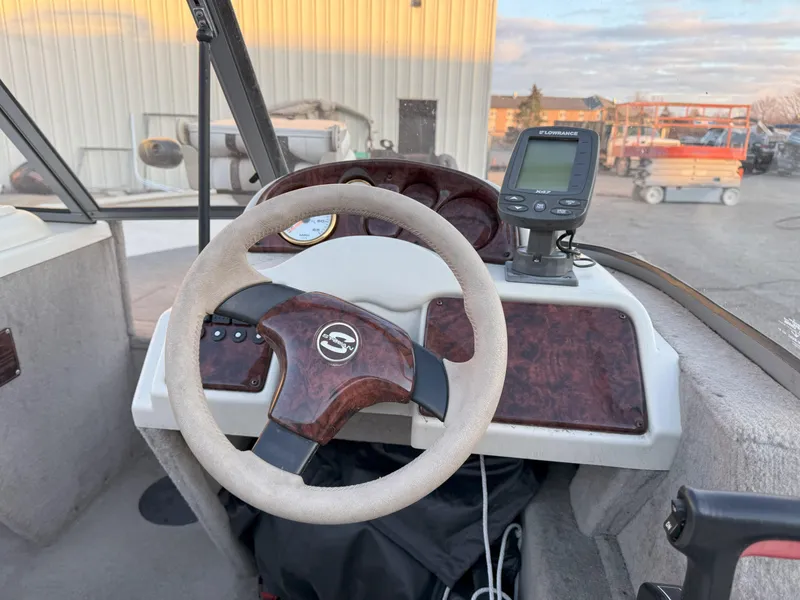 Slide: The Image of Steering console of a 2004 Sylvan 1600 Explorer DC boat with a fish finder. - 7