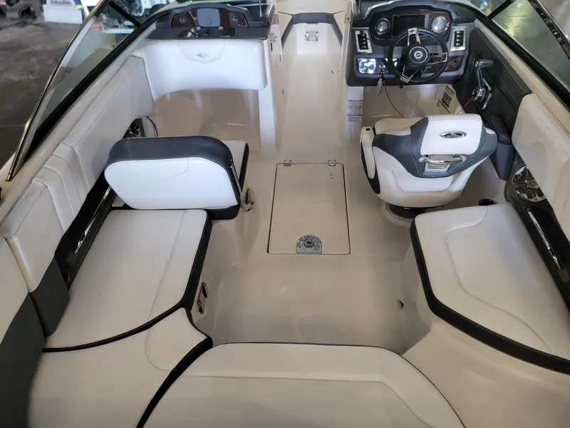 Slide: The Image of Interior of 2019 Chaparral 237 SSX boat, featuring sleek seating and modern dashboard. - 6