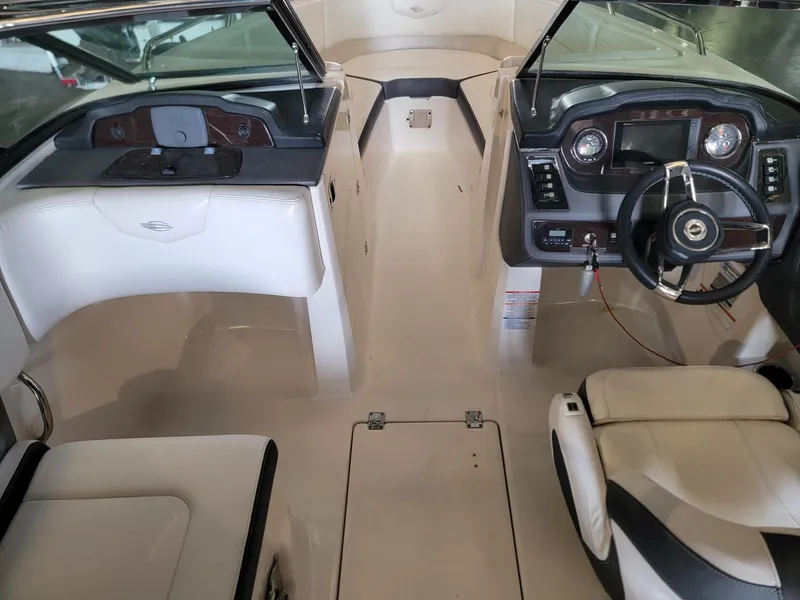 Slide: The Image of 2019 Chaparral 237 SSX boat interior with steering wheel and dashboard. - 8