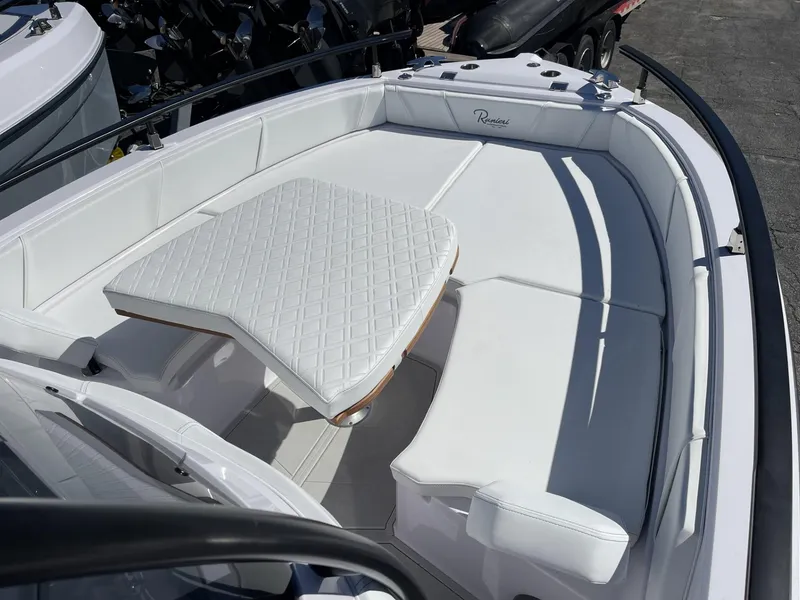 Slide: The Image of 2024 Ranieri Voyager 19S boat covered on a trailer, parked in a marina. - 11