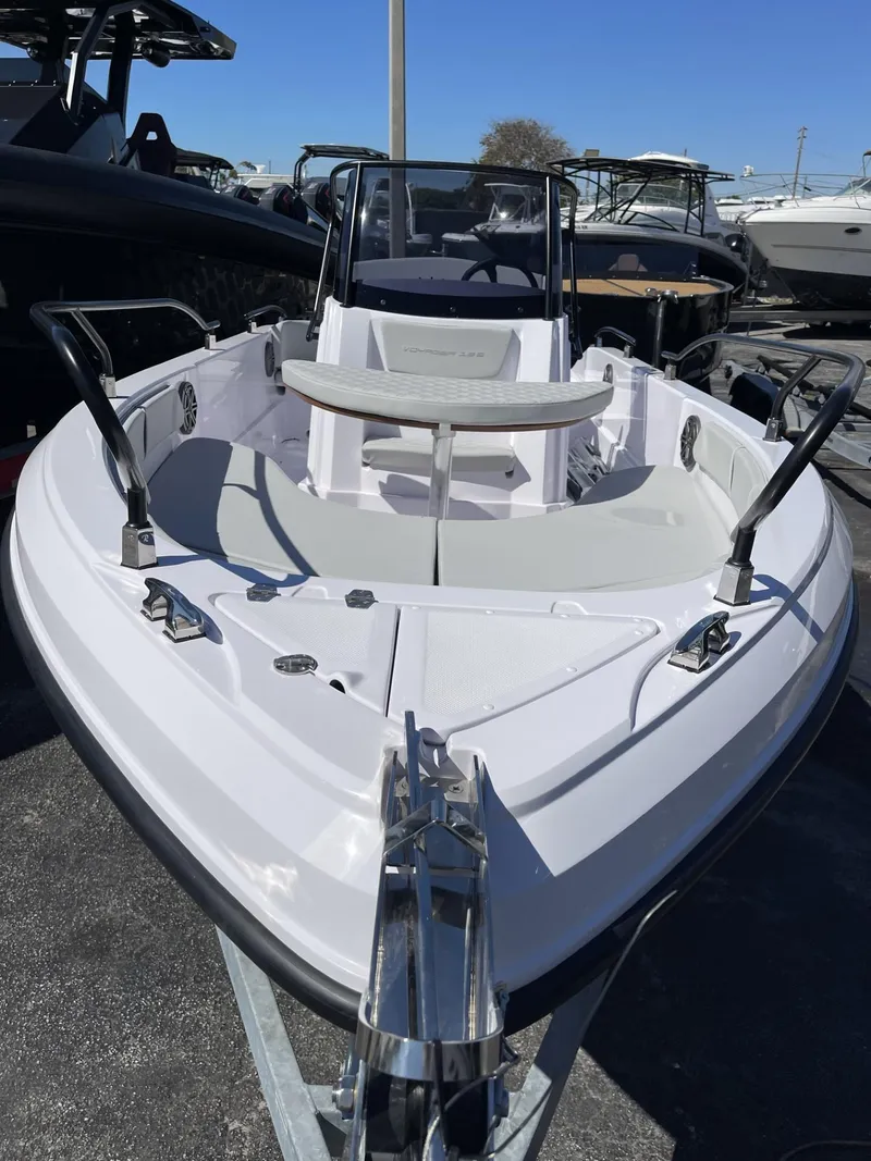 Slide: The Image of 2024 Ranieri Voyager 19S boat on trailer under clear blue sky. - 14