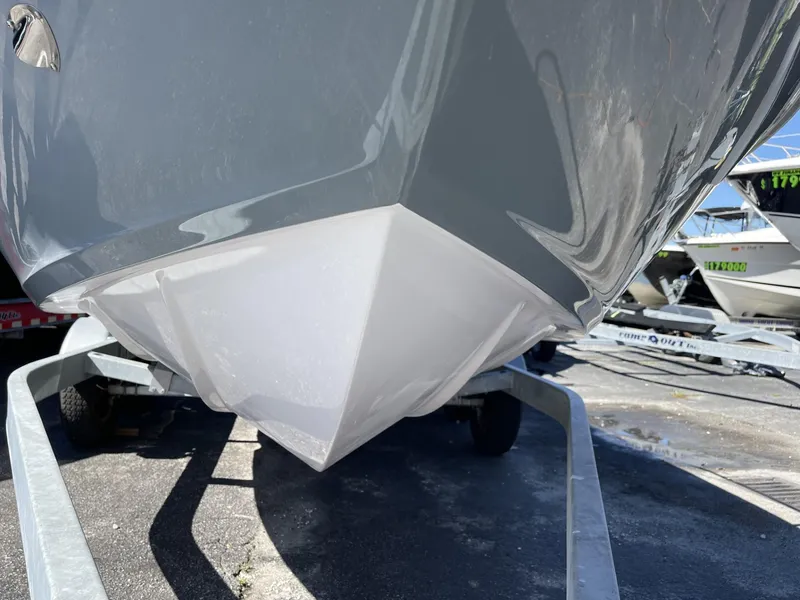 Slide: The Image of 2024 Ranieri Voyager 19S boat hull on trailer, showcasing sleek design. - 23
