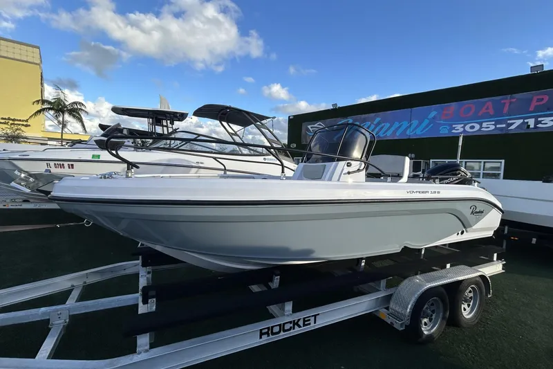 Slide: The Image of 2024 Ranieri Voyager 19S boat on trailer at Miami dealership. - 28