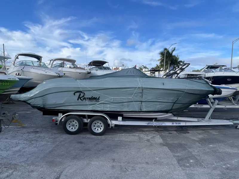 Slide: The Image of 2024 Ranieri Voyager 19S boat with Suzuki engine on clear water. - 9