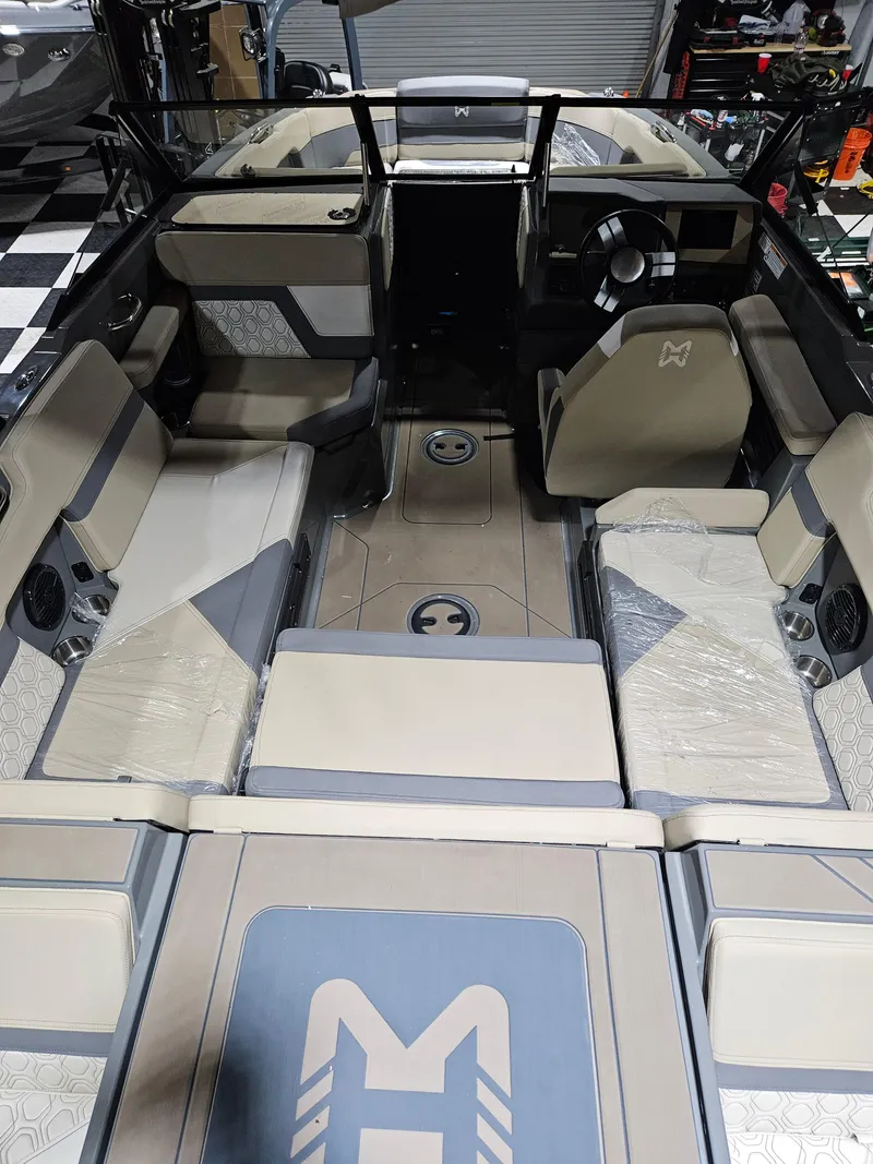 Slide: The Image of 2023 HEYDAY WAKE BOATS H20 interior with modern seating and steering wheel. - 7