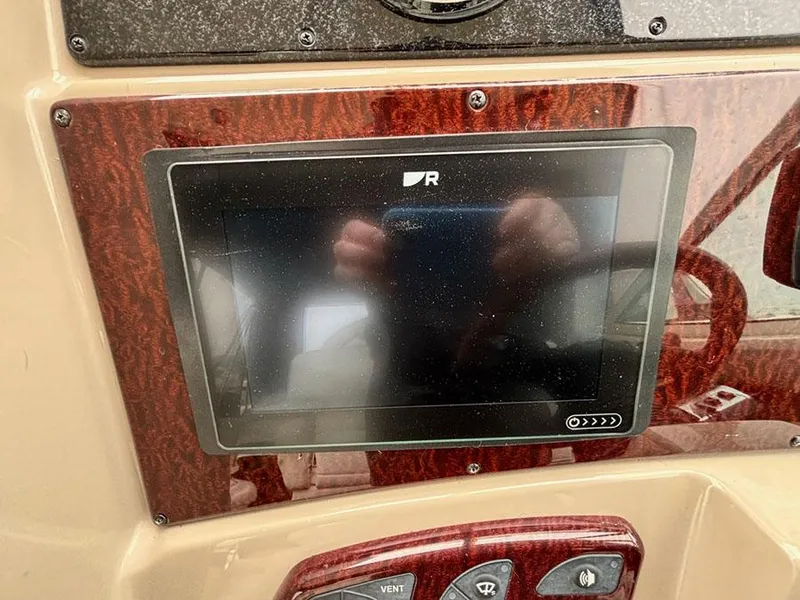 Slide: The Image of Dashboard of a 2006 Sea Ray 290 Sundancer boat with electronic display. - 12