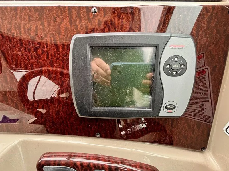 Slide: The Image of Dashboard of 2006 Sea Ray 290 Sundancer with electronic display and controls. - 13