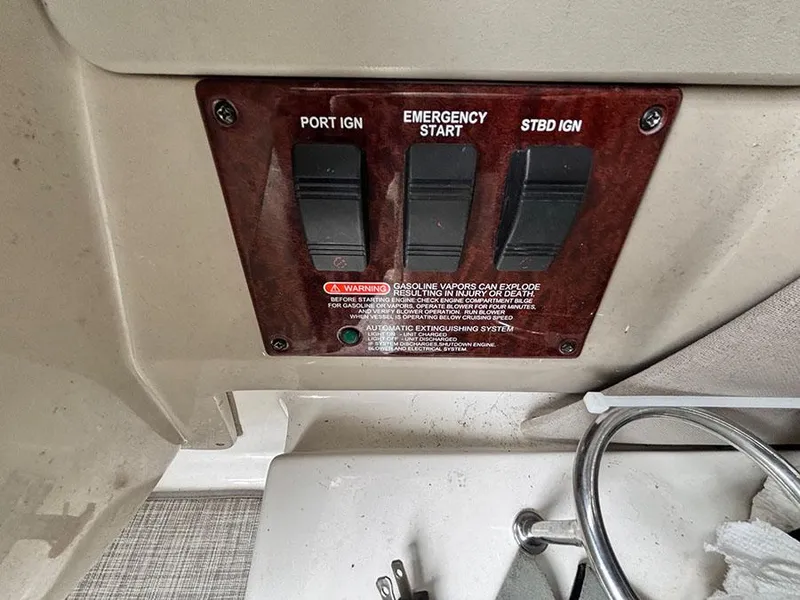 Slide: The Image of Control panel of a 2006 Sea Ray 290 Sundancer boat with ignition switches. - 16