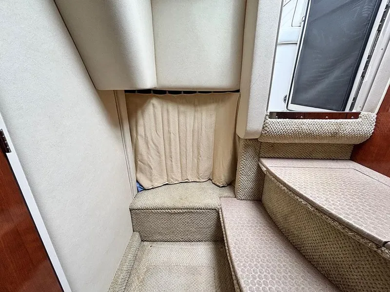 Slide: The Image of Interior cabin of 2006 Sea Ray 290 Sundancer with carpeted steps and curtain. - 25
