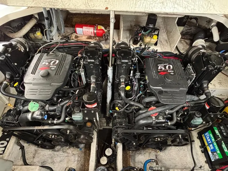 Slide: The Image of Twin MerCruiser engines in a 2006 Sea Ray 290 Sundancer boat engine compartment. - 26