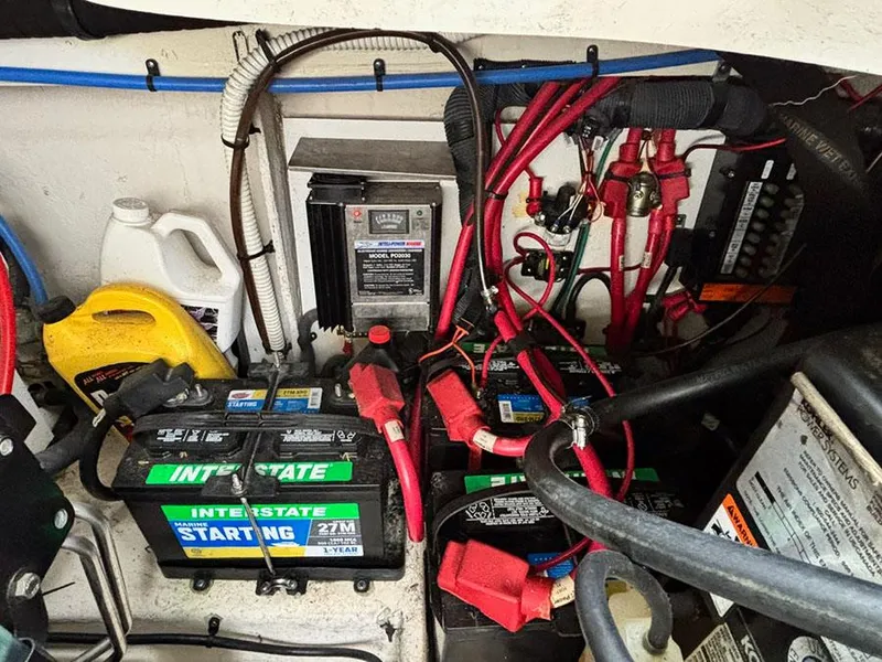 Slide: The Image of Engine compartment of 2006 Sea Ray 290 Sundancer with batteries and wiring. - 27