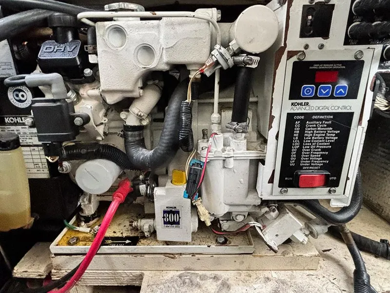Slide: The Image of Engine compartment of a 2006 Sea Ray 290 Sundancer with Kohler generator. - 28