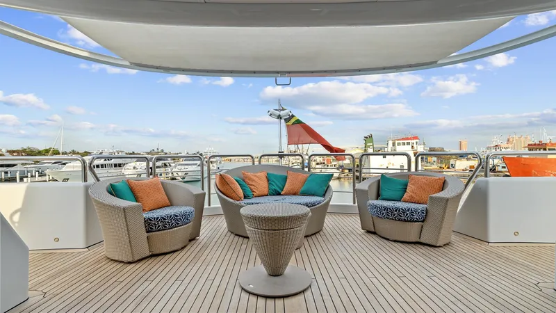 Slide: The Image of Luxurious 2005 New Zealand Yachts Wave Piercer deck with stylish seating and scenic marina view. - 17