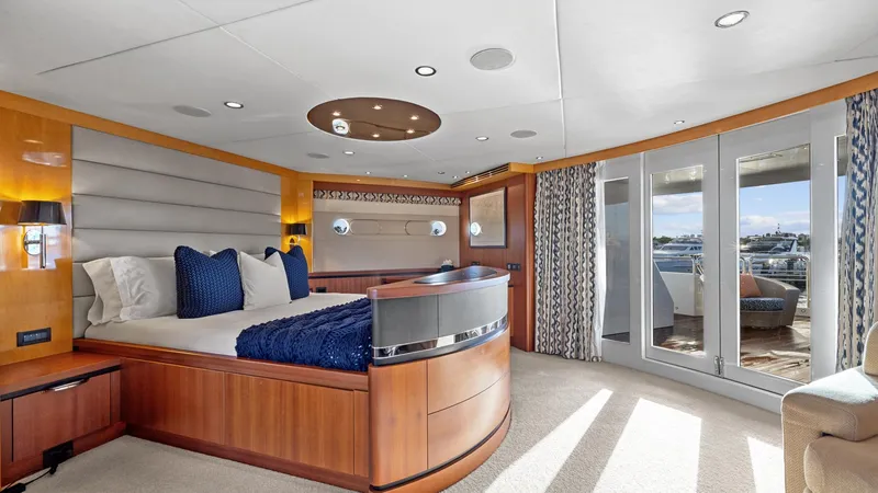 Slide: The Image of Luxurious yacht bedroom with modern design, featuring large windows and elegant furnishings. - 28