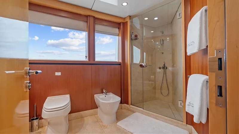Slide: The Image of Luxurious bathroom on 2005 New Zealand Yachts Wave Piercer, featuring glass shower and ocean view. - 34