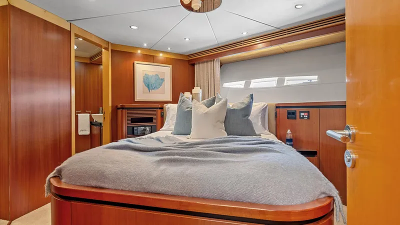 Slide: The Image of Luxurious bedroom interior of 2005 New Zealand Yachts Wave Piercer with elegant wood finish. - 45
