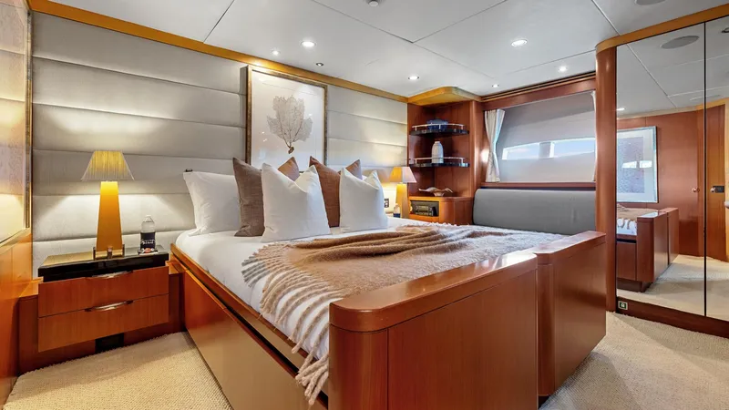Slide: The Image of Luxurious bedroom interior of 2005 New Zealand Yachts Wave Piercer, featuring elegant wood finishes. - 49