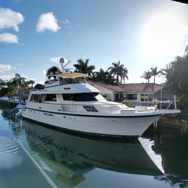The Image of 1989 Hatteras 67 Cockpit Motor Yacht in sunny harbor. - 0