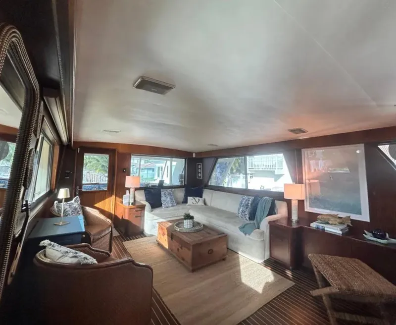 Slide: The Image of Luxurious interior of 1989 Hatteras 67 Cockpit Motor Yacht with elegant seating and decor. - 26
