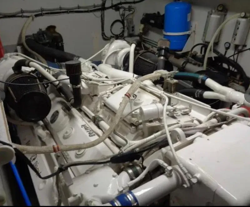 Slide: The Image of Engine room of 1989 Hatteras 67 Cockpit Motor Yacht with visible machinery and components. - 33