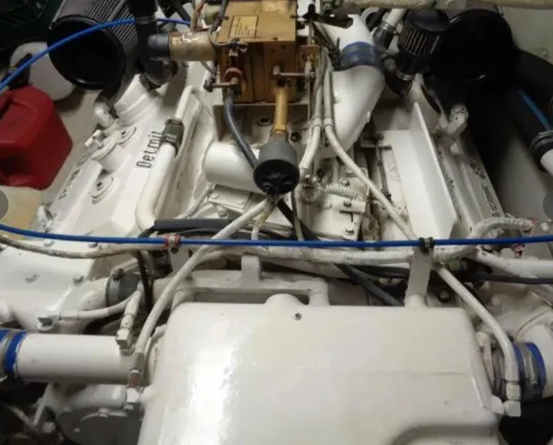Slide: The Image of Engine of 1989 Hatteras 67 Cockpit Motor Yacht, showcasing mechanical components and wiring. - 30