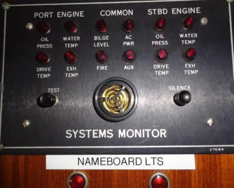 Slide: The Image of Hatteras 67 Cockpit Motor Yacht 1989 systems monitor panel with engine indicators and controls. - 6
