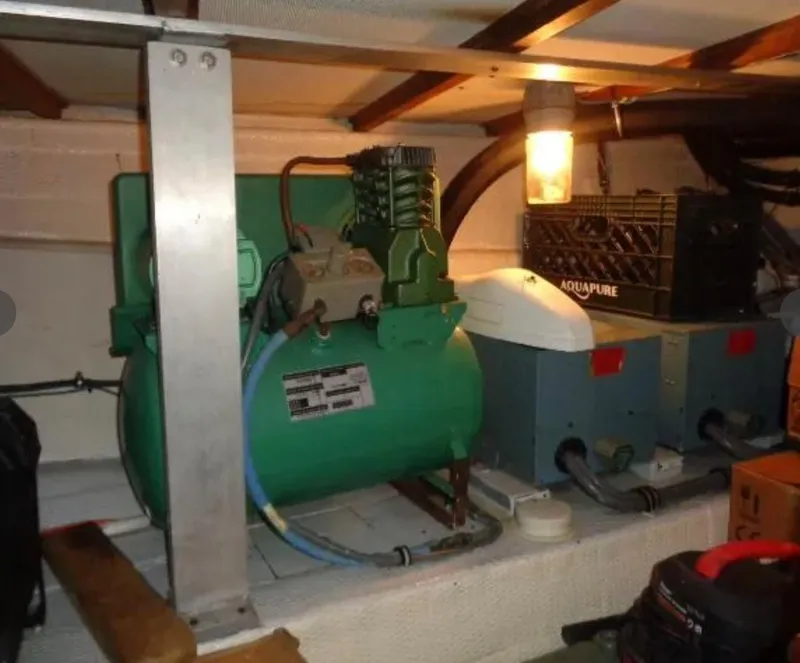 Slide: The Image of Engine room of 1989 Hatteras 67 Cockpit Motor Yacht with machinery and equipment. - 41