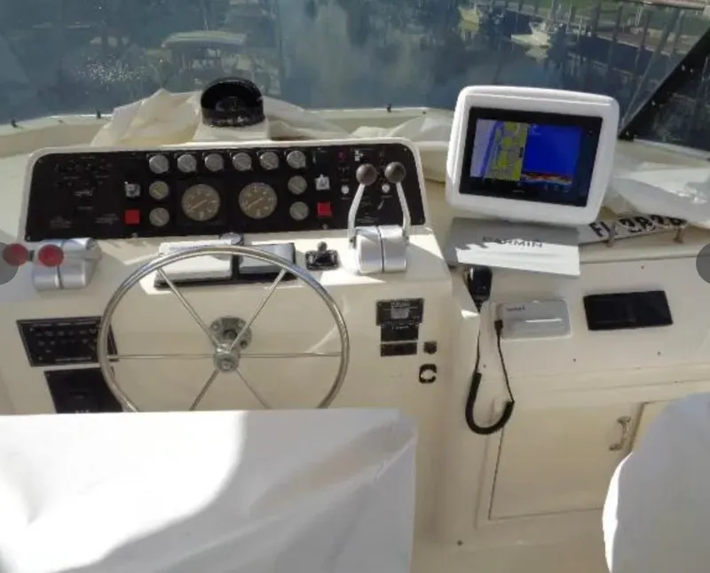 Slide: The Image of Cockpit of 1989 Hatteras 67 Cockpit Motor Yacht with navigation equipment and steering wheel. - 27