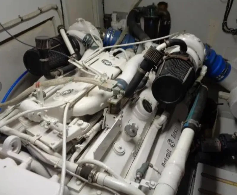Slide: The Image of Engine room of 1989 Hatteras 67 Cockpit Motor Yacht with visible machinery and components. - 36
