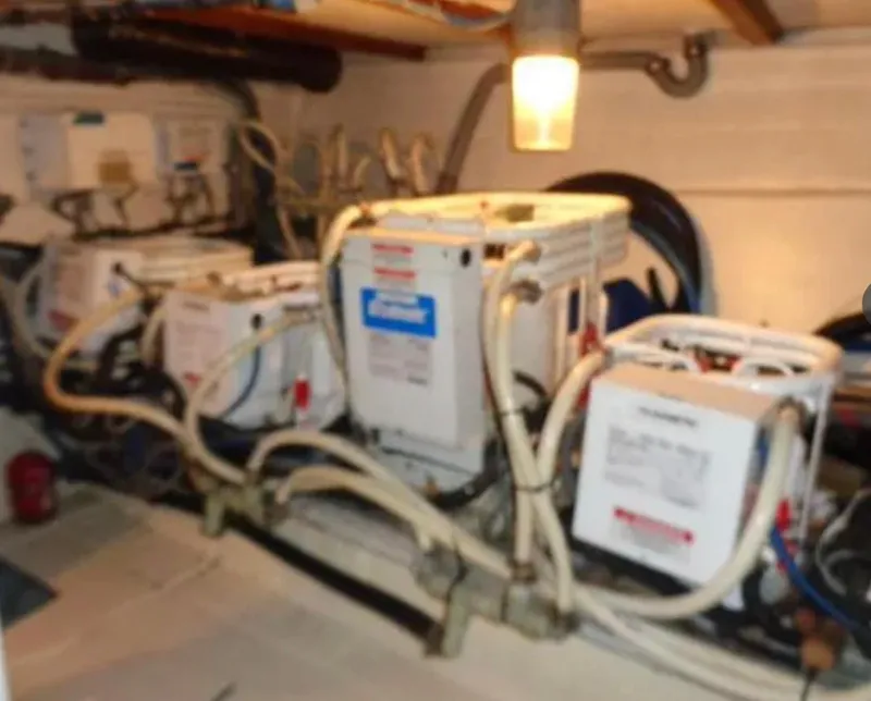 Slide: The Image of Engine room of 1989 Hatteras 67 Cockpit Motor Yacht with mechanical equipment and wiring. - 37