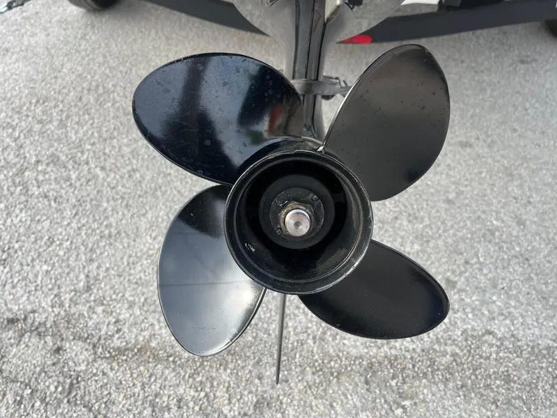 Slide: The Image of 2022 Tahoe T16 boat propeller on pavement background. - 12