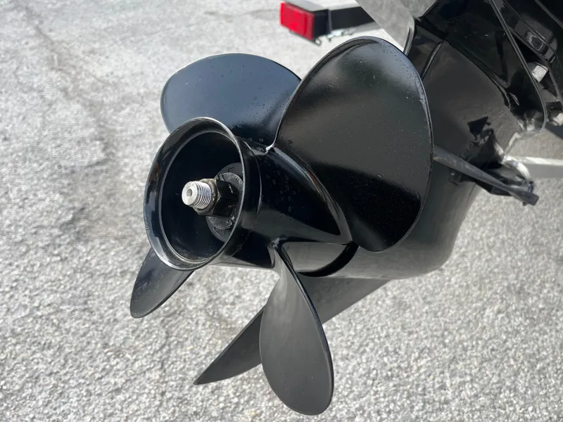 Slide: The Image of 2022 Tahoe T16 boat propeller on asphalt background. - 13