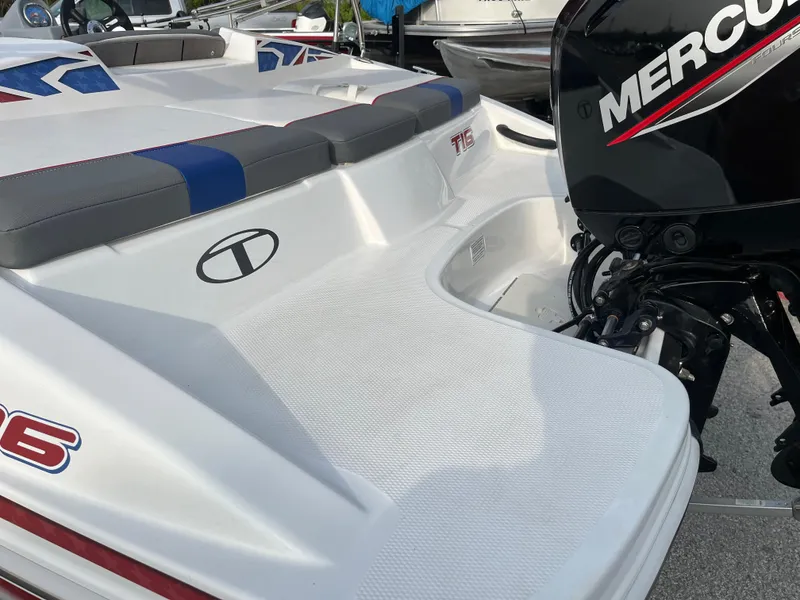 Slide: The Image of 2022 Tahoe T16 boat with Mercury engine, featuring sleek white design and comfortable seating. - 23