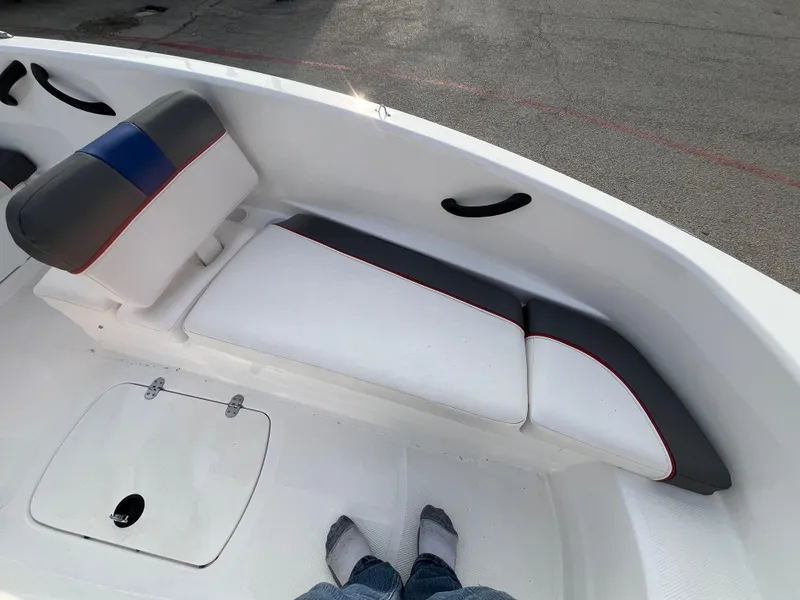Slide: The Image of Interior of 2022 Tahoe T16 boat with white and gray seating. - 29