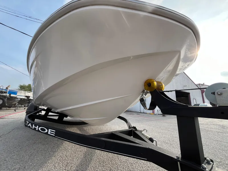 Slide: The Image of 2022 Tahoe T16 boat on trailer, showcasing sleek hull design. - 4