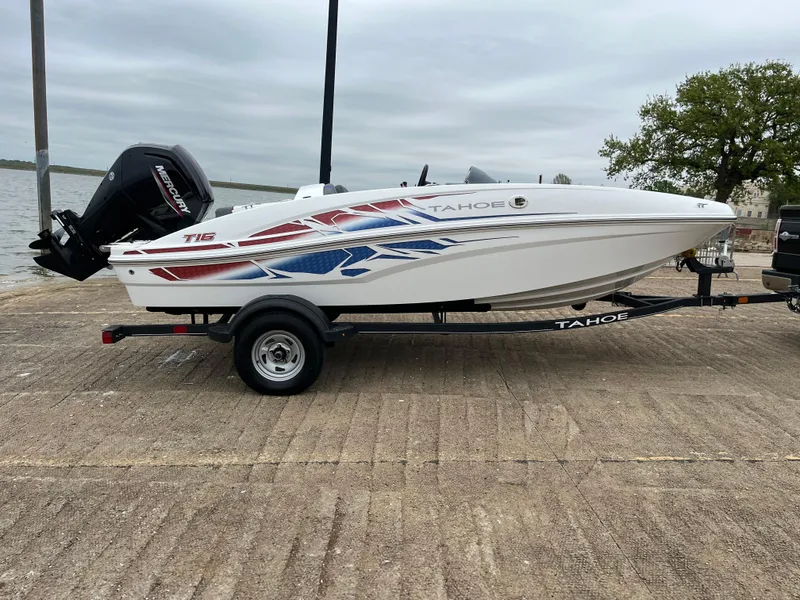 Slide: The Image of 2022 Tahoe T16 boat on trailer, featuring sleek design and vibrant graphics. - 41