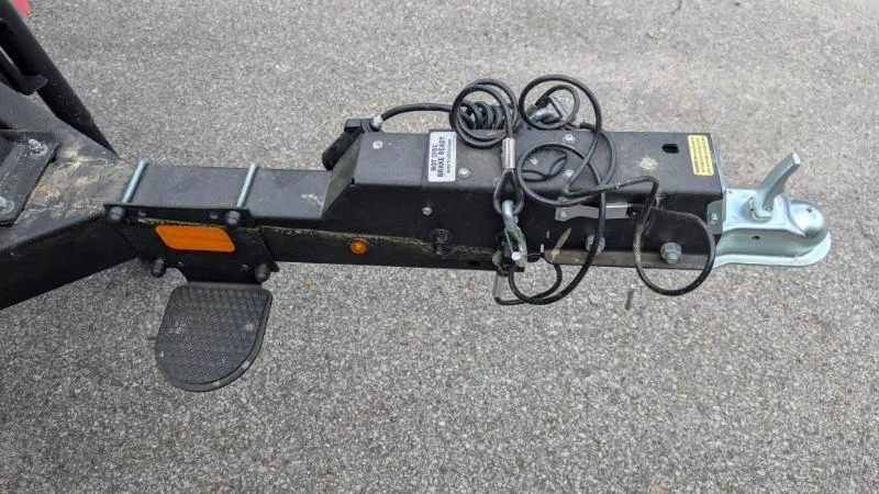 Slide: The Image of Trailer hitch of 2024 Sun Tracker Bass Buggy 18 DLX on asphalt surface. - 4