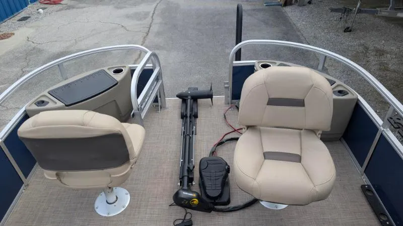 Slide: The Image of 2024 Sun Tracker Bass Buggy 18 DLX pontoon boat interior with seating and controls. - 8